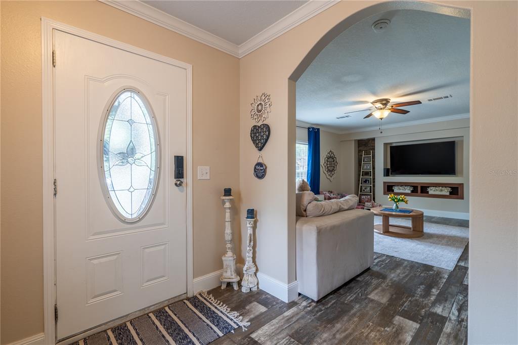 1508 East Winnetka Street Hernando, FL 34442 - Photo 25 of 55 a view of a livingroom with furniture and a flat screen tv