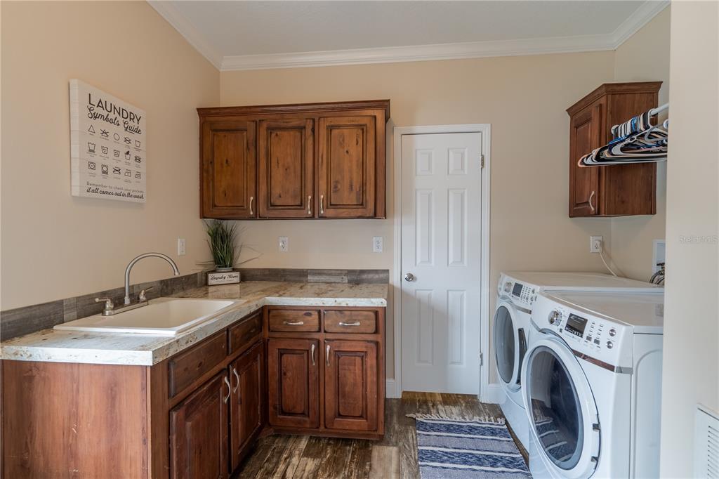 1508 East Winnetka Street Hernando, FL 34442 - Photo 27 of 55 a utility room with sink dryer and washer