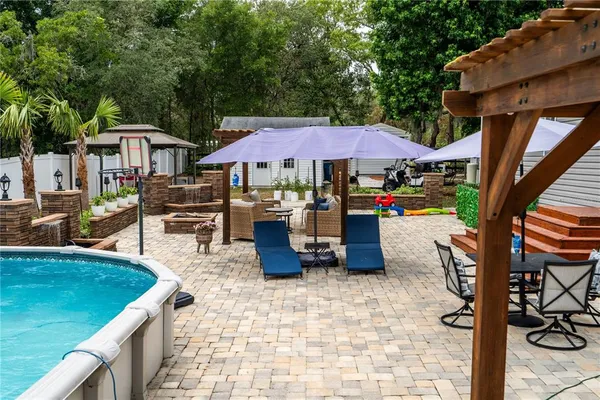 a view of a chairs and tables in the patio