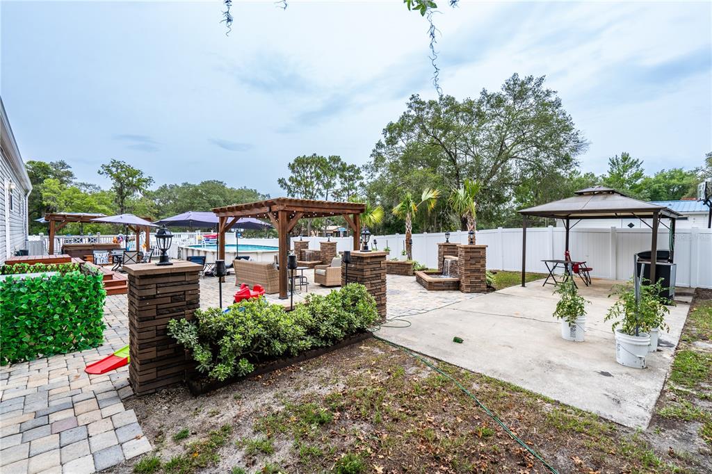 1508 East Winnetka Street Hernando, FL 34442 - Photo 35 of 55 a front view of a house with garden