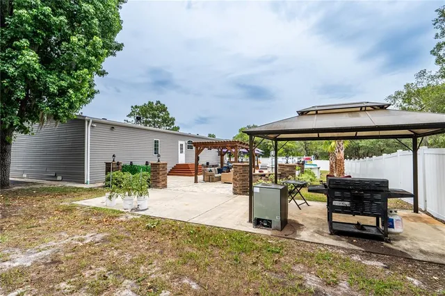 a outdoor living space with patio furniture and garden view