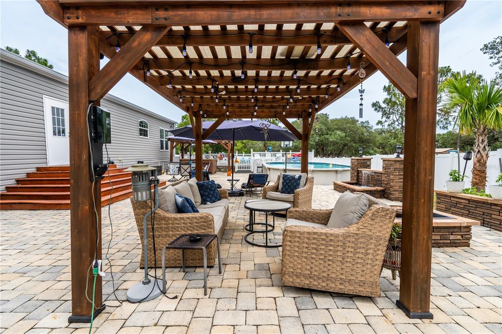 1508 East Winnetka Street Hernando, FL 34442 - Photo 38 of 55 a outdoor living space with patio furniture and garden view