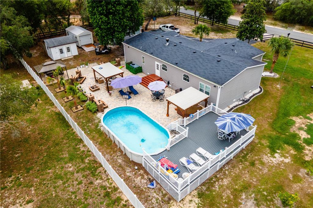 1508 East Winnetka Street Hernando, FL 34442 - Photo 42 of 55 an aerial view of a house with a swimming pool