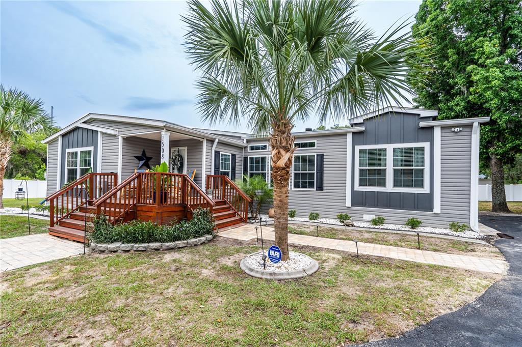 1508 East Winnetka Street Hernando, FL 34442 - Photo 46 of 55 a front view of house with yard outdoor seating and barbeque oven