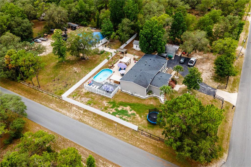 1508 East Winnetka Street Hernando, FL 34442 - Photo 54 of 55 an aerial view of a house with a garden