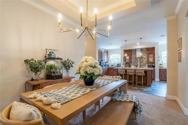 a kitchen with a table and chairs in it