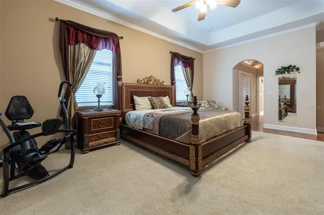 a bathroom with a granite countertop toilet a sink and a mirror