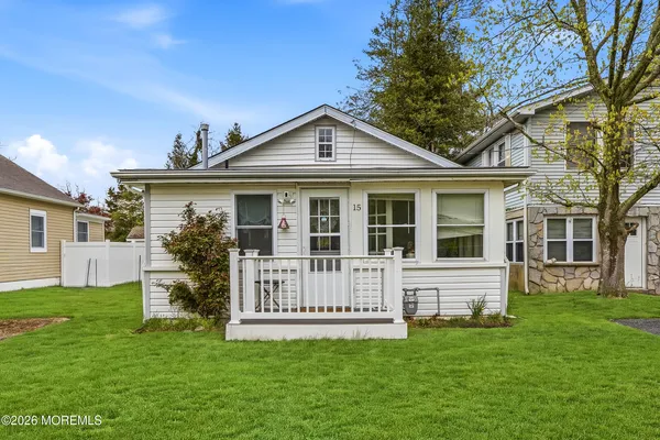 a view of a house with a yard and a garden
