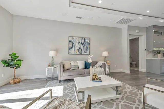 a view of a kitchen counter space dining table and chairs