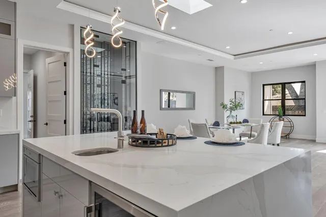 a bedroom with a bed and a potted plant