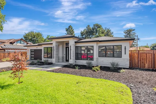 a house view with a garden space