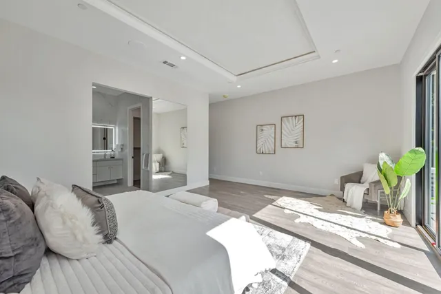 a view of hallway with wooden floor