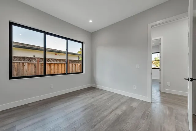 a bathroom with a granite countertop toilet a sink and shower