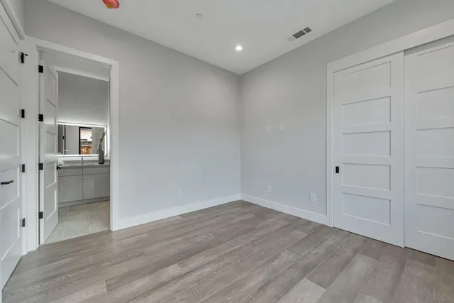 a bathroom with a double vanity sink mirror and shower