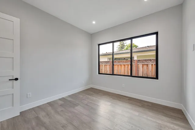 a house view with a sitting space and garden