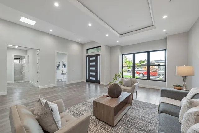 a living room with furniture and a table