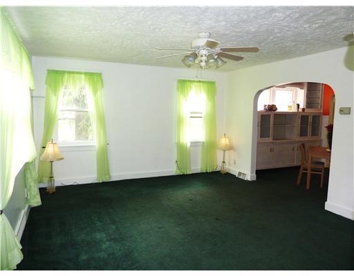 Living Room. PLUSH CARPET AND CEILING FAN WITH LIGHT.