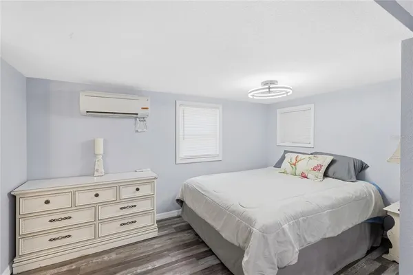 a bedroom with a bed and a dresser