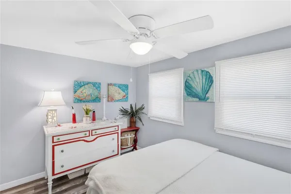 a room with a bed window and table
