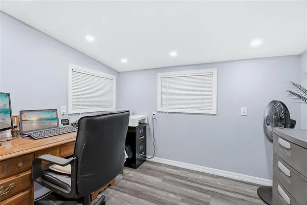a view of workspace with furniture and a window
