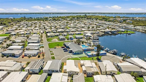 an aerial view of residential building and lake