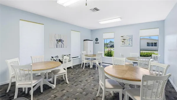a dining room with furniture and window