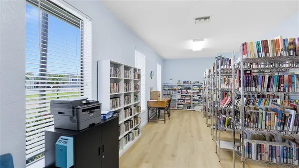 a reading room with furniture and book shelf