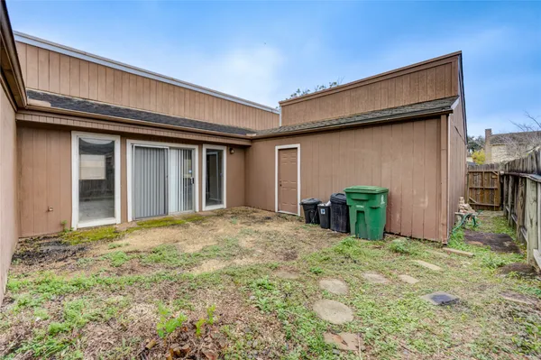 a view of backyard of a house