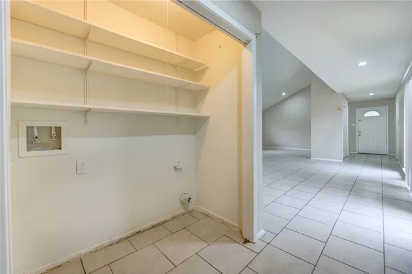 a view of a hallway with closet