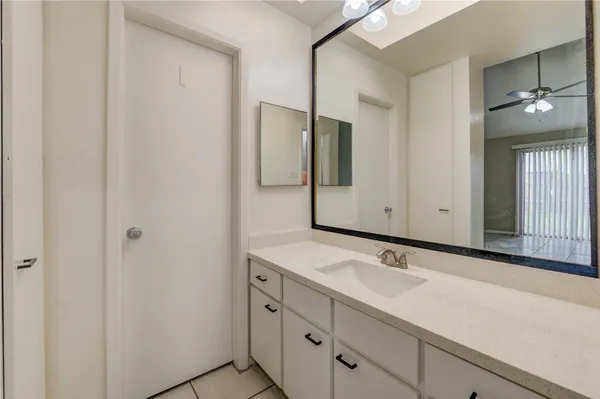 a bathroom with a sink and mirror