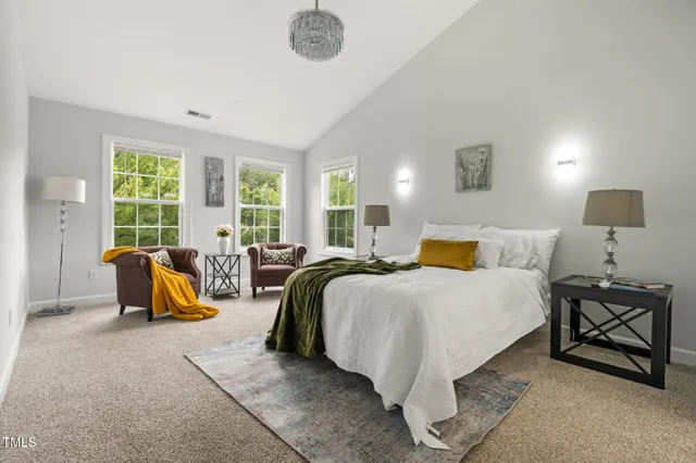 a bedroom with a bed and glass window