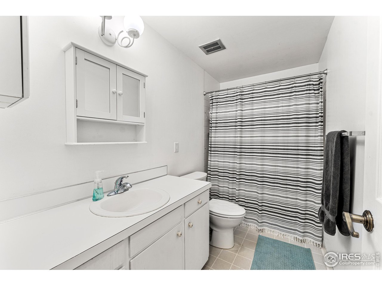 2695 Vassar Drive Boulder, CO 80305 - Photo 26 of 36 main floor full bath in hall also serves two secondary bedrooms