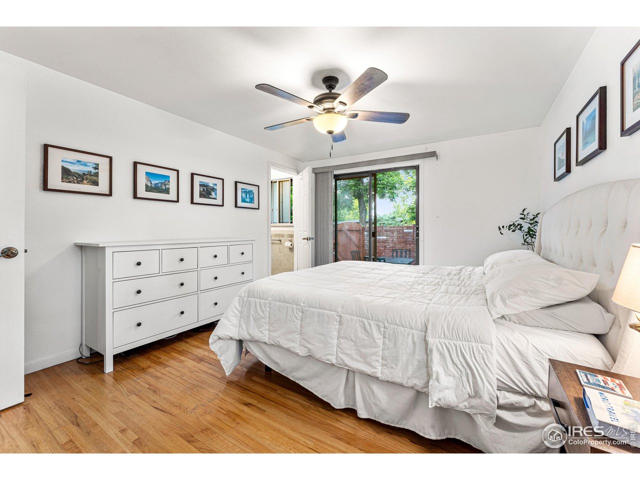 2695 Vassar Drive Boulder, CO 80305 - Photo 4 of 36 primary bedroom with sliding doors to brick patio