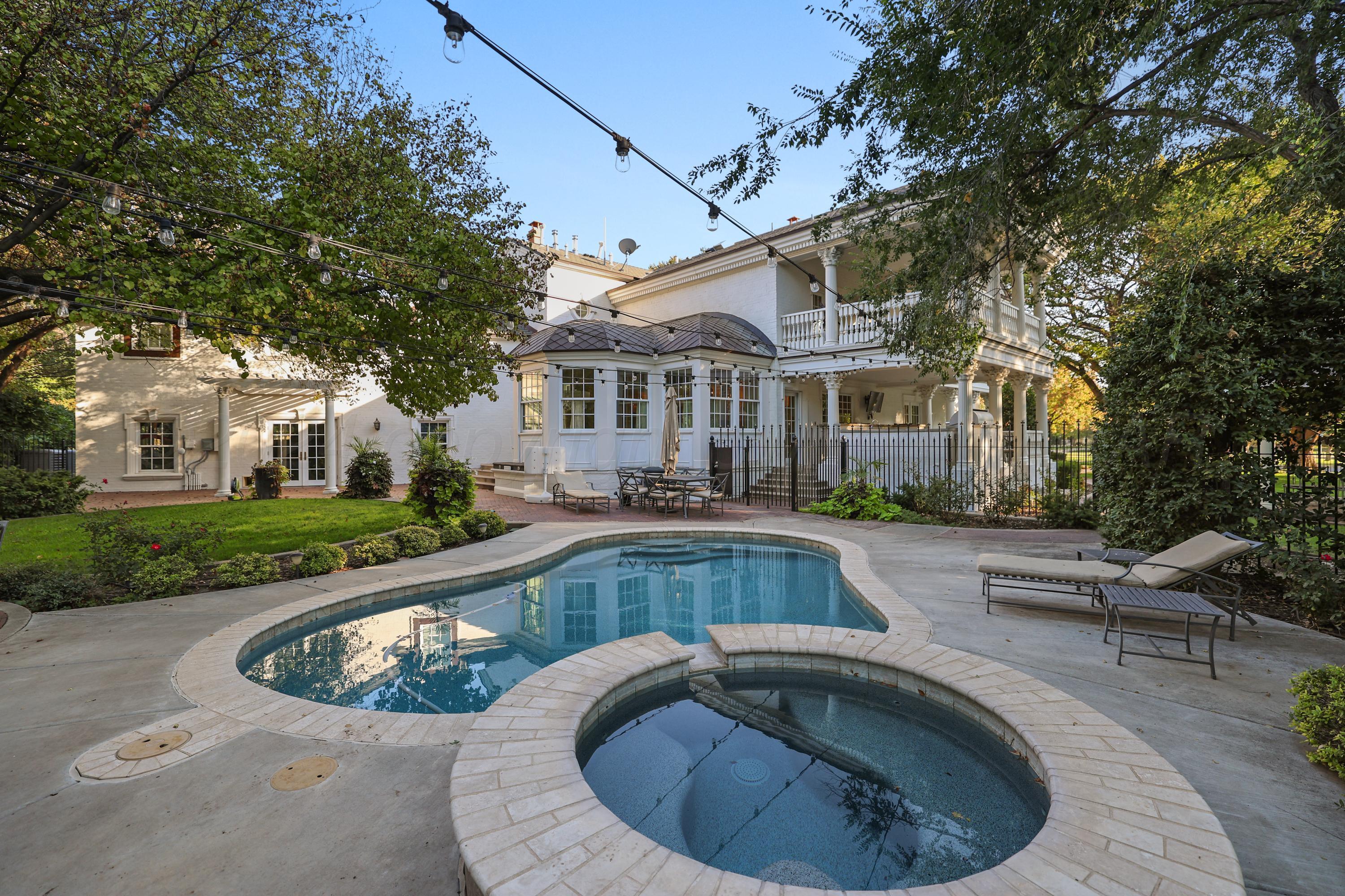 33 Oldham Circle Amarillo, TX 79109 - Photo 11 of 96 a view of a house with swimming pool and sitting area