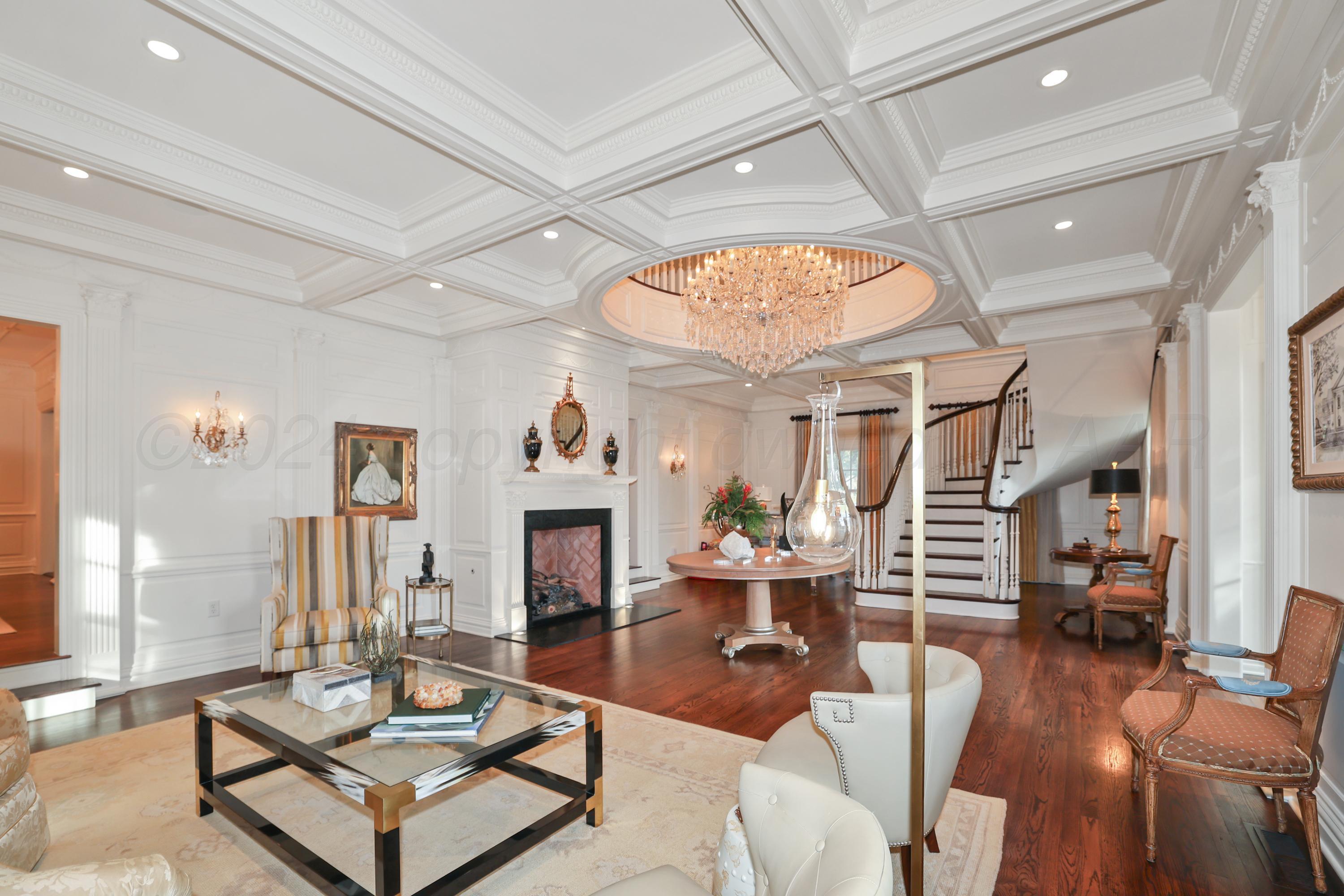 33 Oldham Circle Amarillo, TX 79109 - Photo 24 of 96 a living room with furniture a fireplace and a chandelier