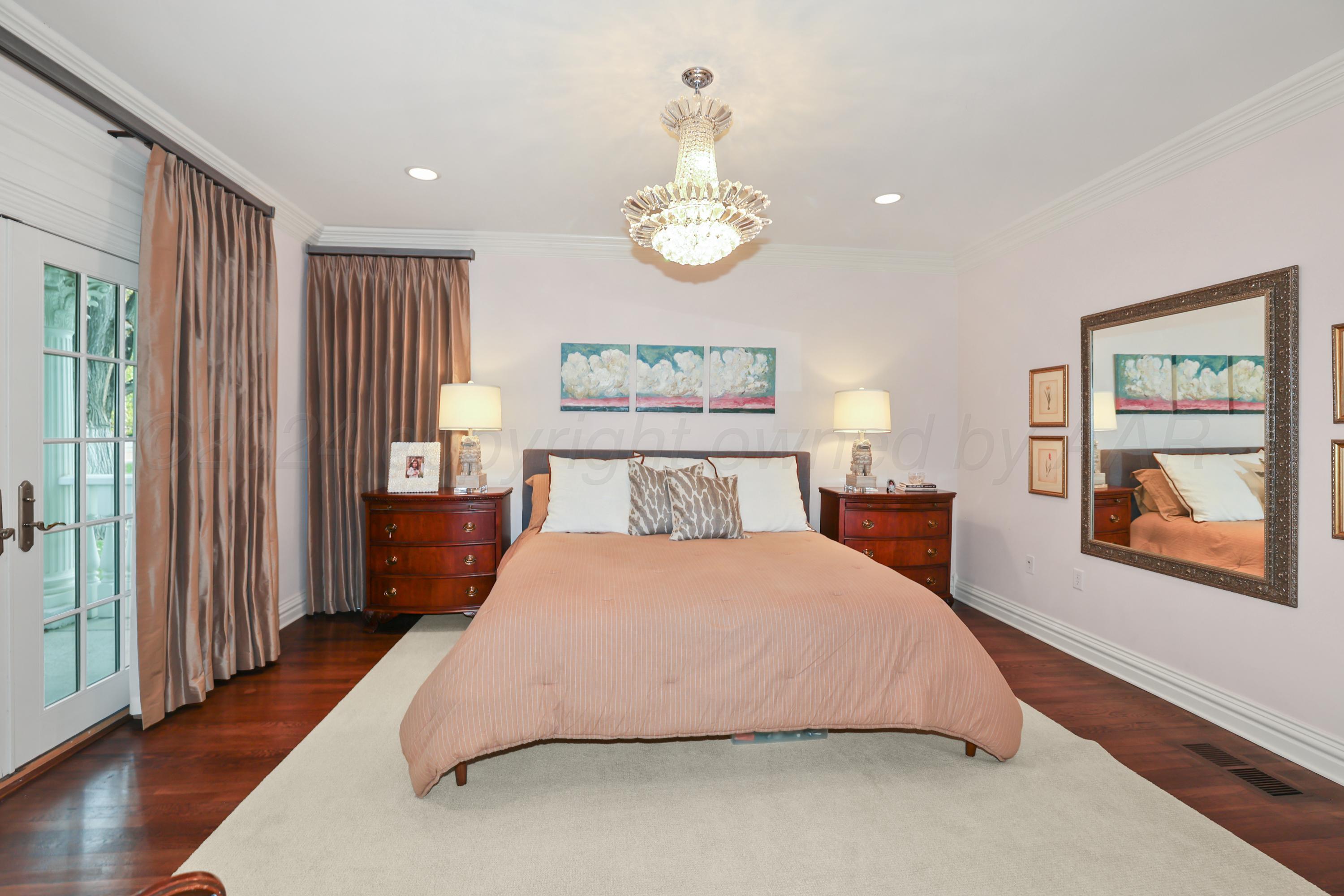 33 Oldham Circle Amarillo, TX 79109 - Photo 53 of 96 a bedroom with a large bed and a window