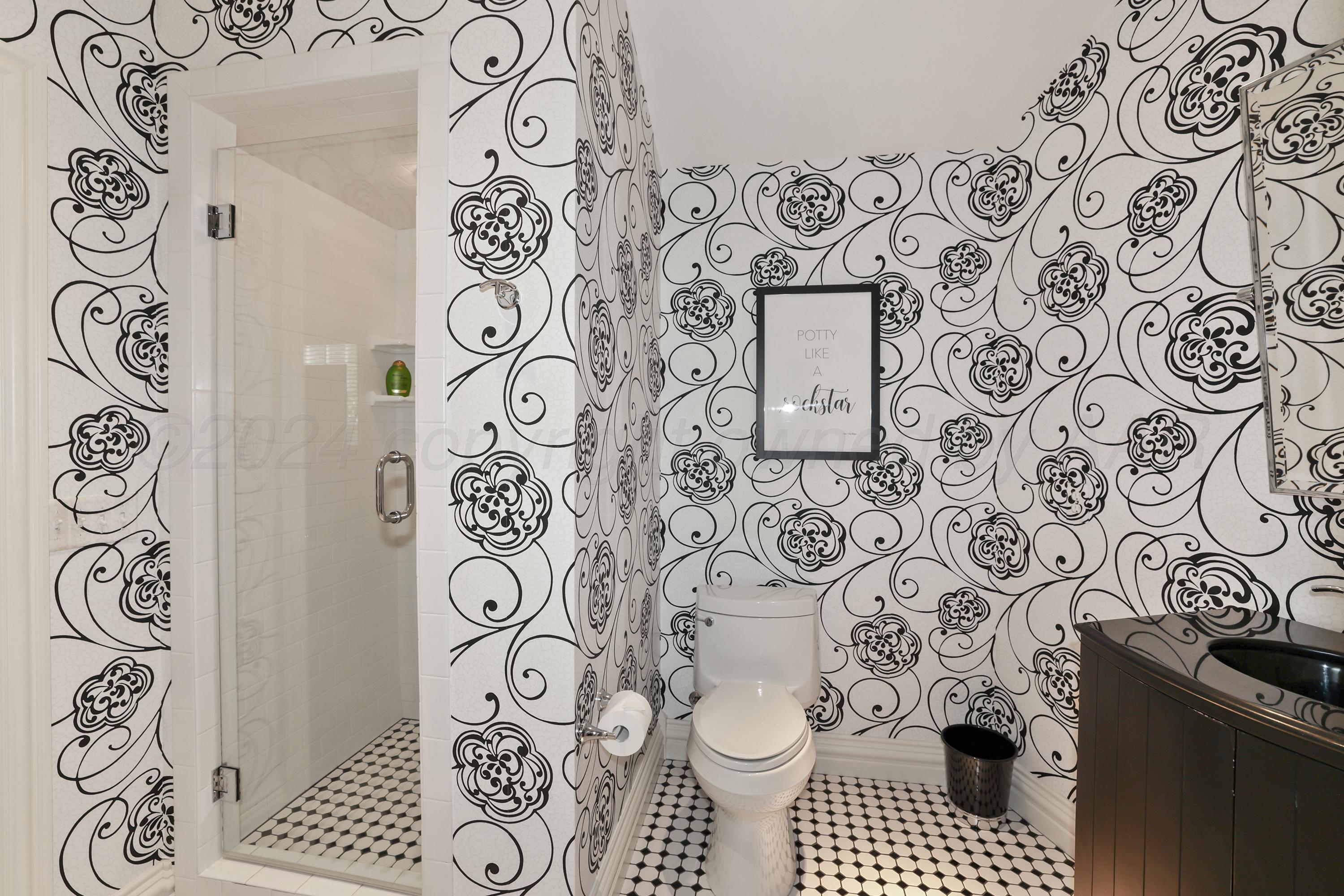 33 Oldham Circle Amarillo, TX 79109 - Photo 65 of 96 a bathroom with a toilet and a shower curtain