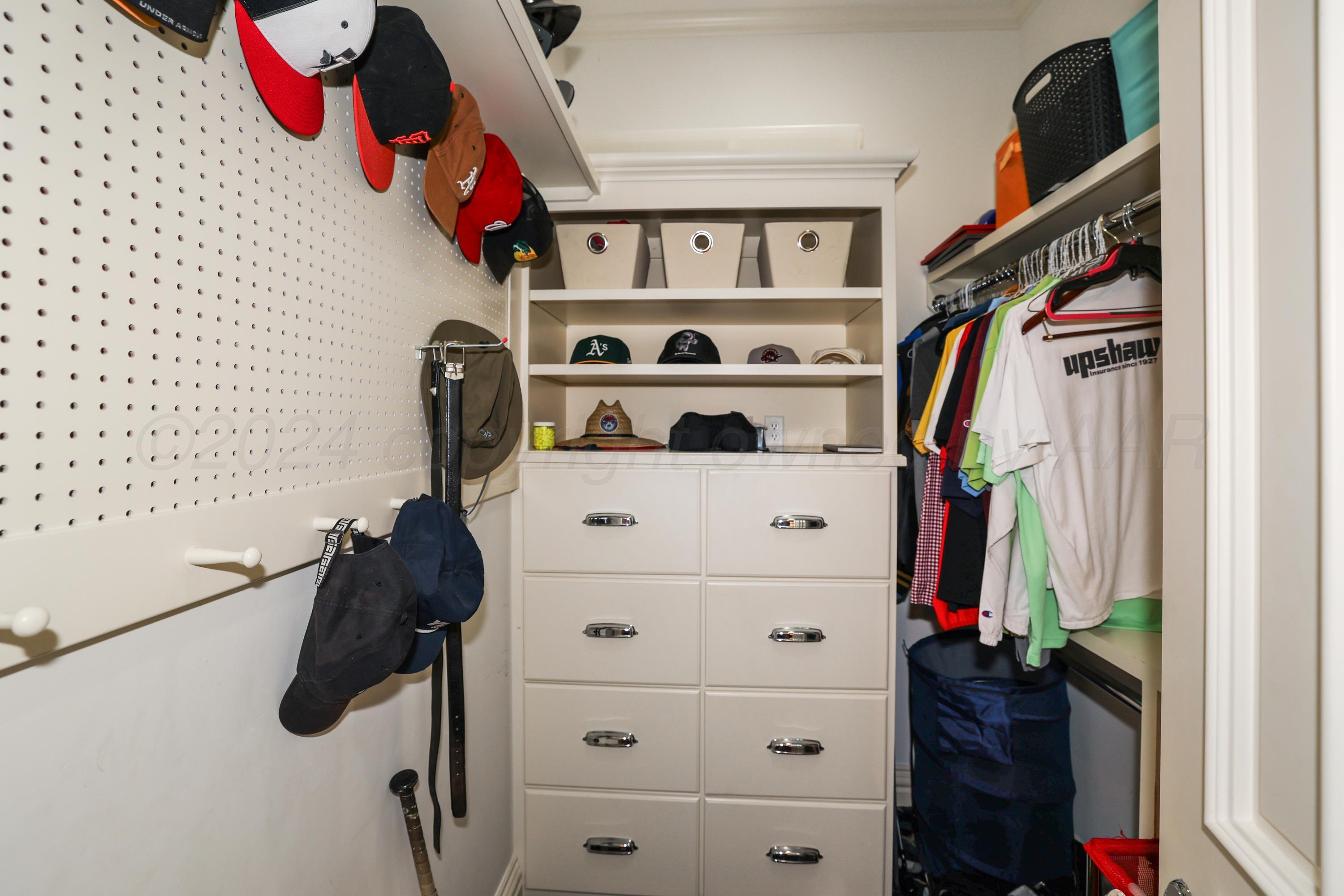 33 Oldham Circle Amarillo, TX 79109 - Photo 88 of 96 a view of walk in closet with clothes and shoes