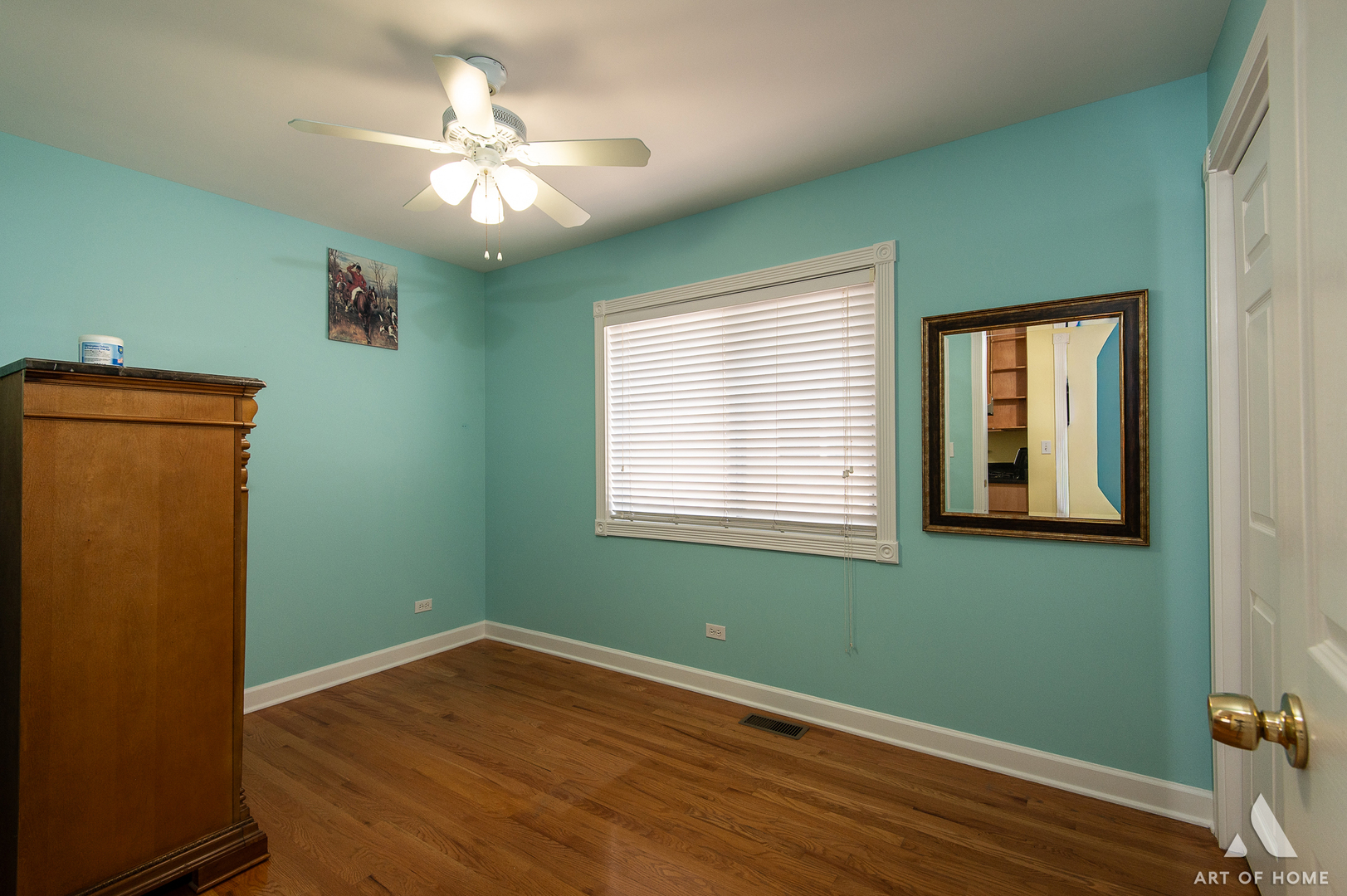 7319 West 58th Place Summit, IL 60501 - Photo 16 of 30 a view of an empty room with window and wooden floor