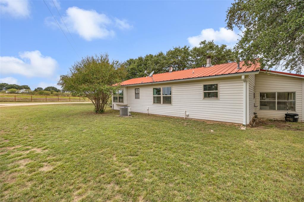 1900 Farm To Market 590, Unit A Zephyr, TX 76890 - Photo 21 of 40 a view of house with outdoor space and swimming pool
