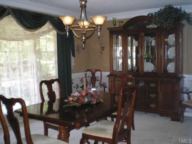 1606 Medfield Road Raleigh, NC 27607 - Photo 3 of 10 a view of a dining room with furniture and chandelier