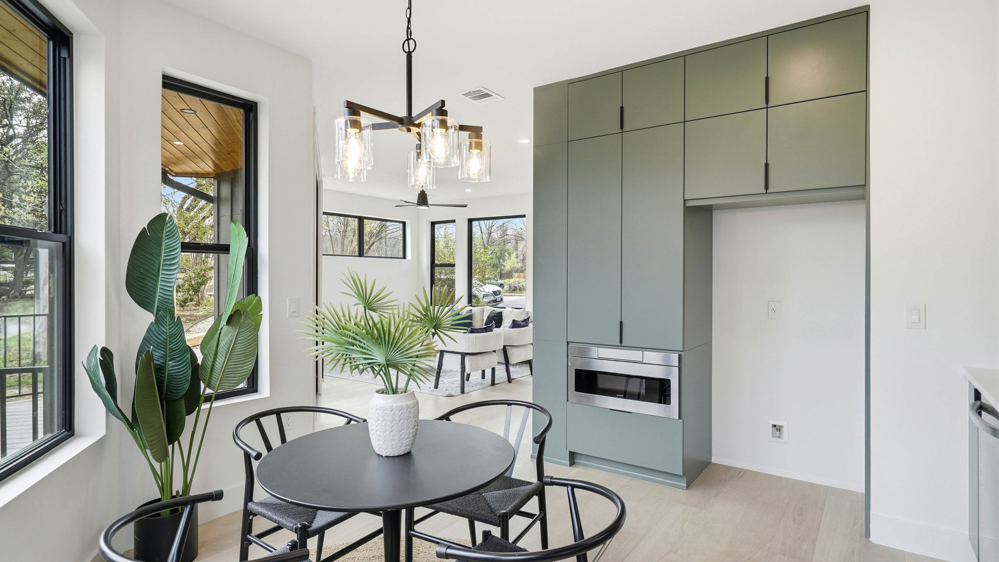 300 Lightsey Road, Unit 2 Austin, TX 78704 - Photo 16 of 30 a view of a dining room with furniture window and wooden floor