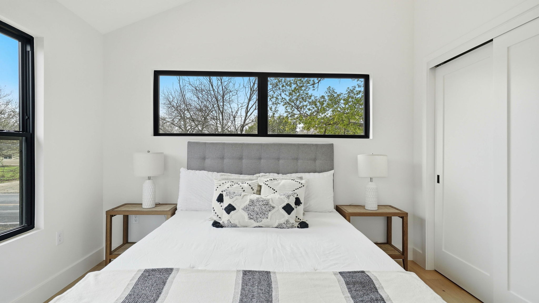 300 Lightsey Road, Unit 2 Austin, TX 78704 - Photo 22 of 30 a bed sitting in a bedroom next to a window