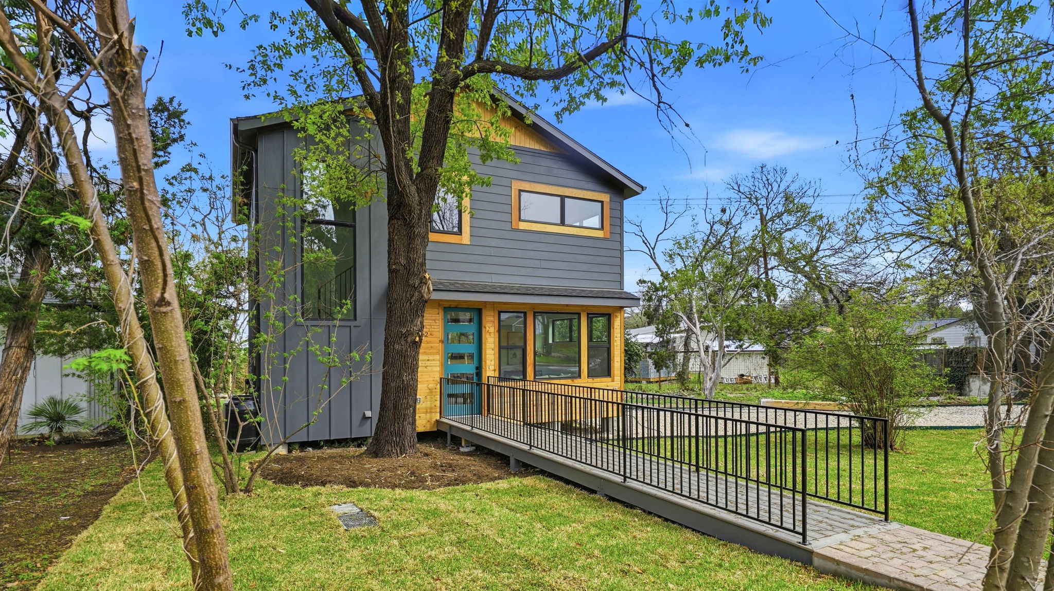 300 Lightsey Road, Unit 2 Austin, TX 78704 - Photo 3 of 30 a view of a house with a small yard and wooden fence