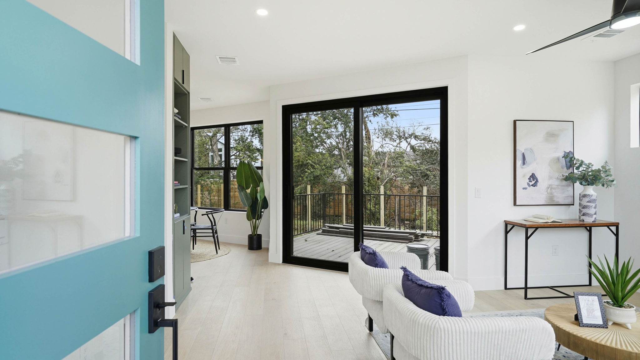 300 Lightsey Road, Unit 2 Austin, TX 78704 - Photo 5 of 30 a living room with furniture large windows and a flat screen tv