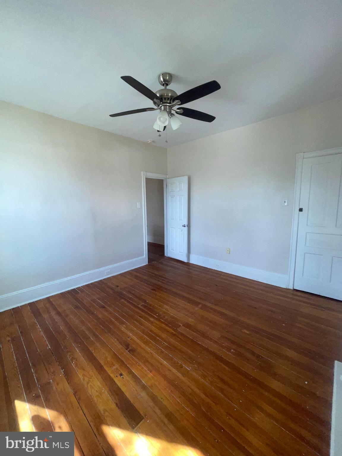 7611 Ridge Avenue, Unit 2 Philadelphia, PA 19128 - Photo 11 of 16 a view of empty room with wooden floor