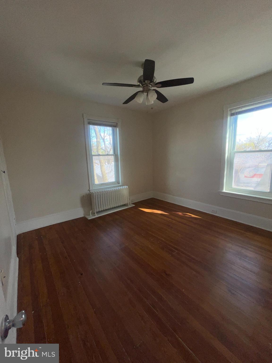 7611 Ridge Avenue, Unit 2 Philadelphia, PA 19128 - Photo 12 of 16 a view of empty room with wooden floor and fan