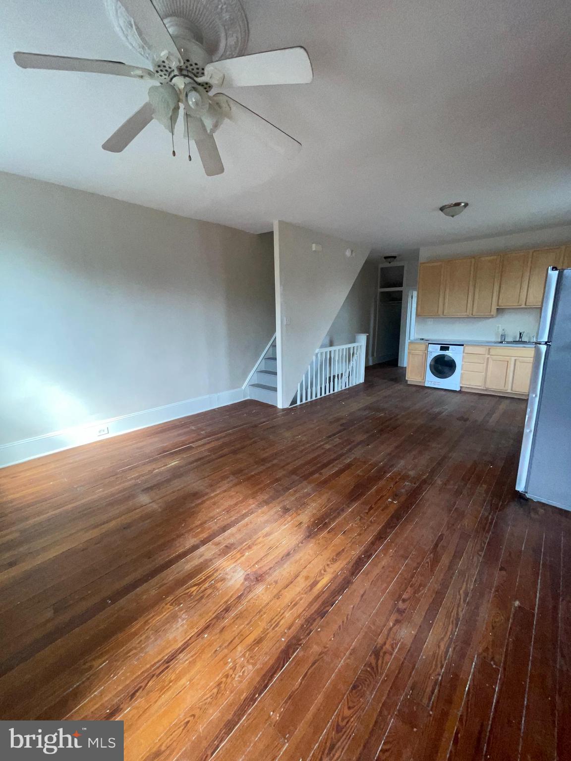 7611 Ridge Avenue, Unit 2 Philadelphia, PA 19128 - Photo 8 of 16 an empty room with wooden floor fan and windows