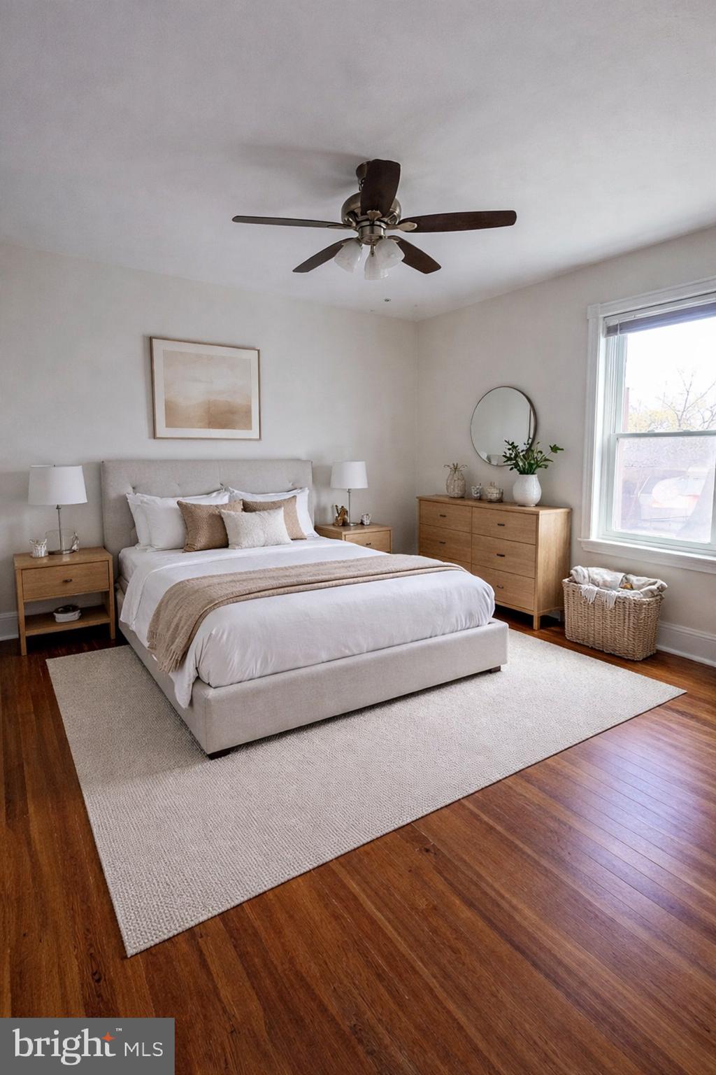 7611 Ridge Avenue, Unit 2 Philadelphia, PA 19128 - Photo 10 of 16 a bedroom with a bed and a dresser