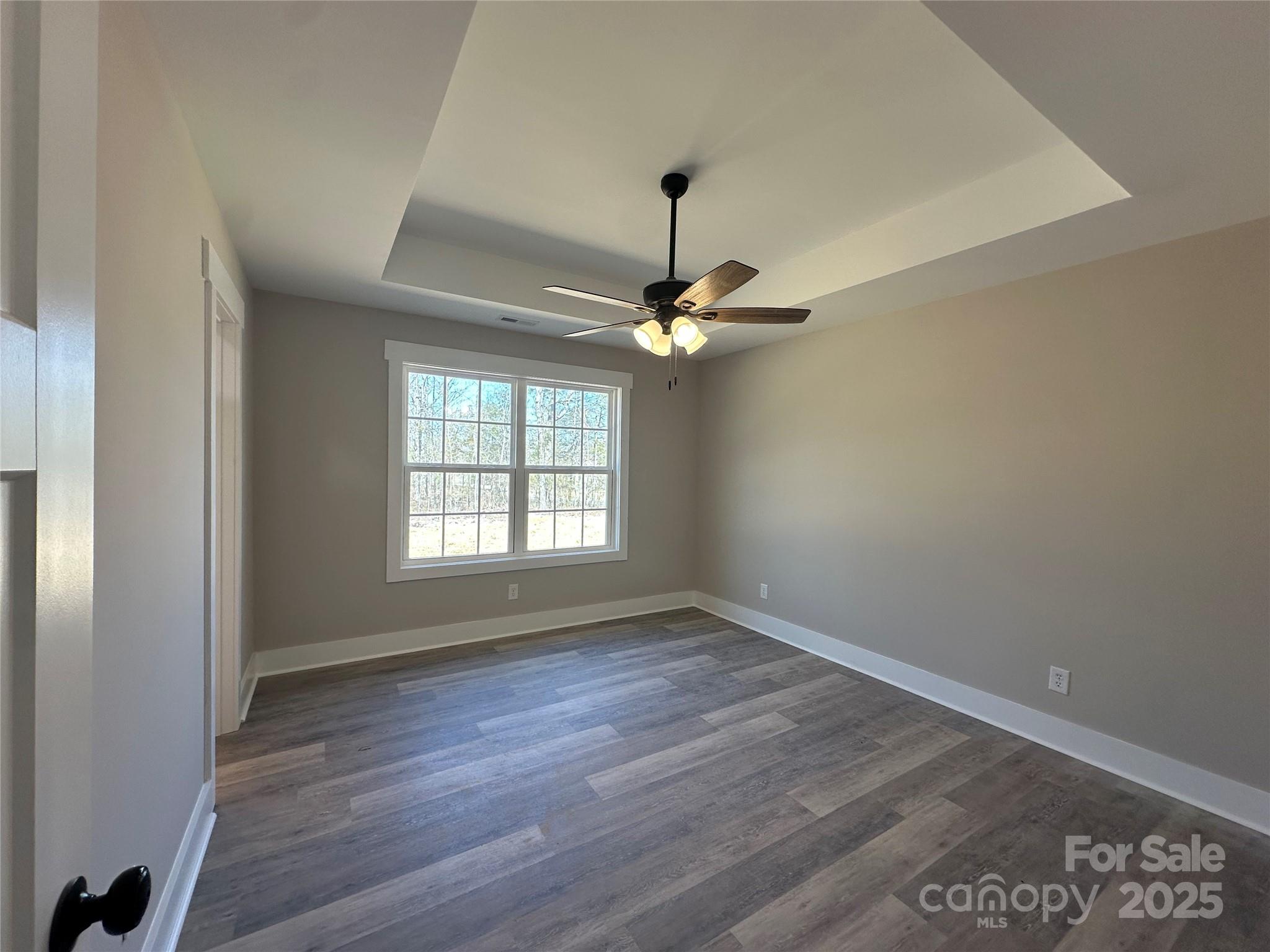 3537 Taxahaw Road Lancaster, SC 29720 - Photo 6 of 8 a view of an empty room with wooden floor and a window